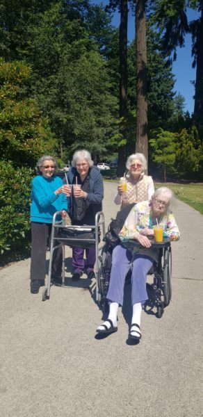 group of elderly women at the park thanks to transportation services